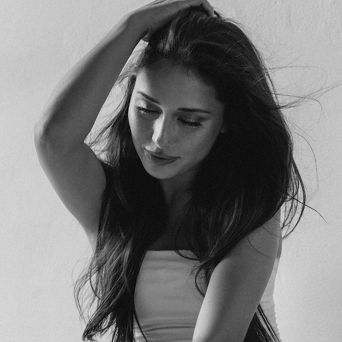 Woman with long hair in black and white.